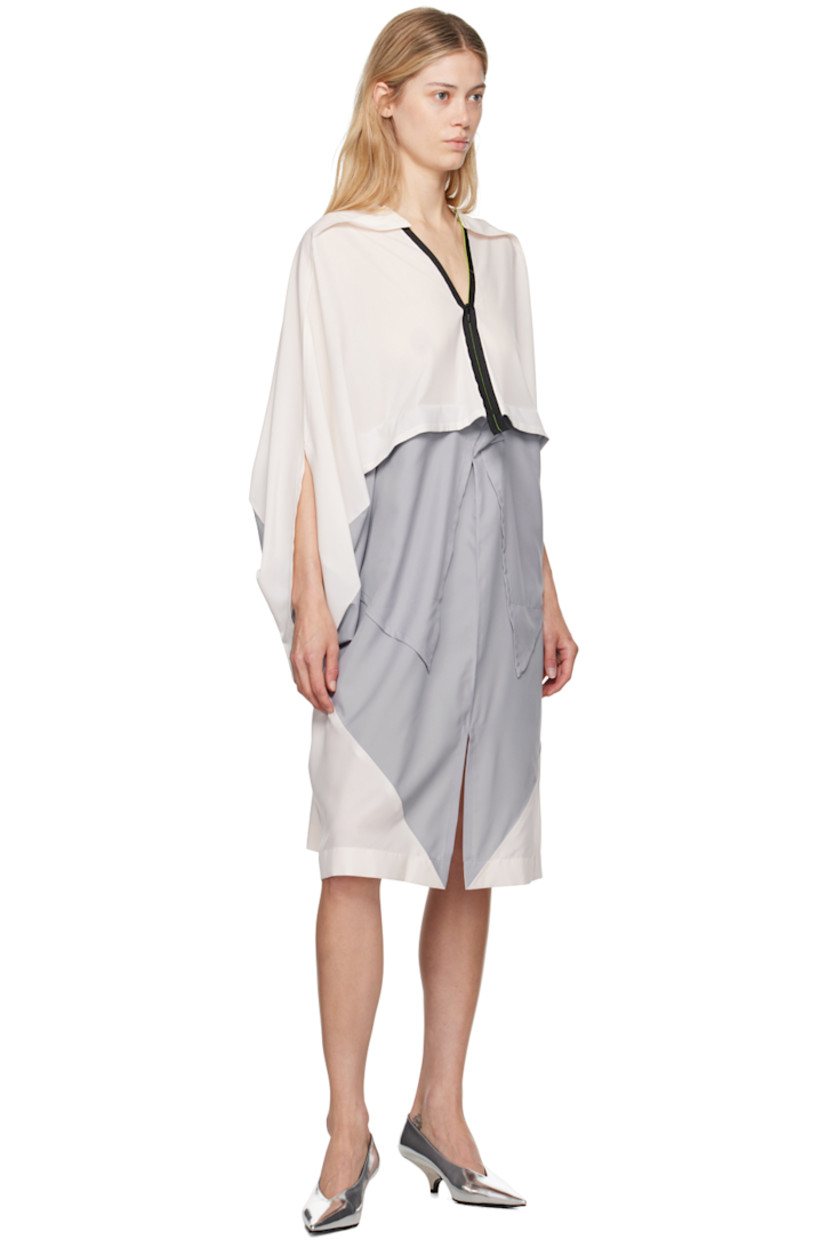 Polyester chiffon dress. Pinched seams throughout.

· Draped construction
· V-neck
· Zip closure
· Patch pockets
· Slit at front hem

Supplier color: Light gray/Off-white