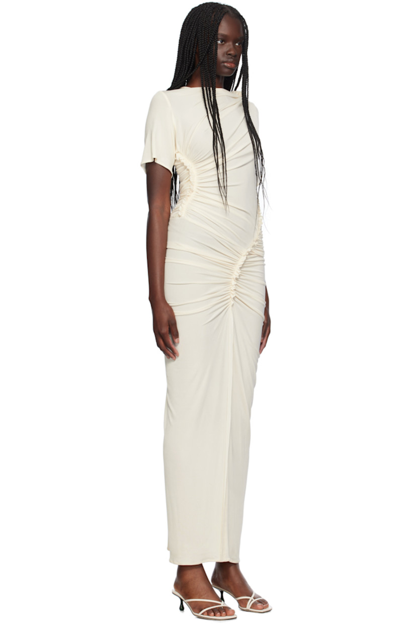 Stretch viscose ribbed jersey dress. Ruching and ruffled trim throughout.

· Asymmetrical construction
· Round neck

Supplier color: Off white