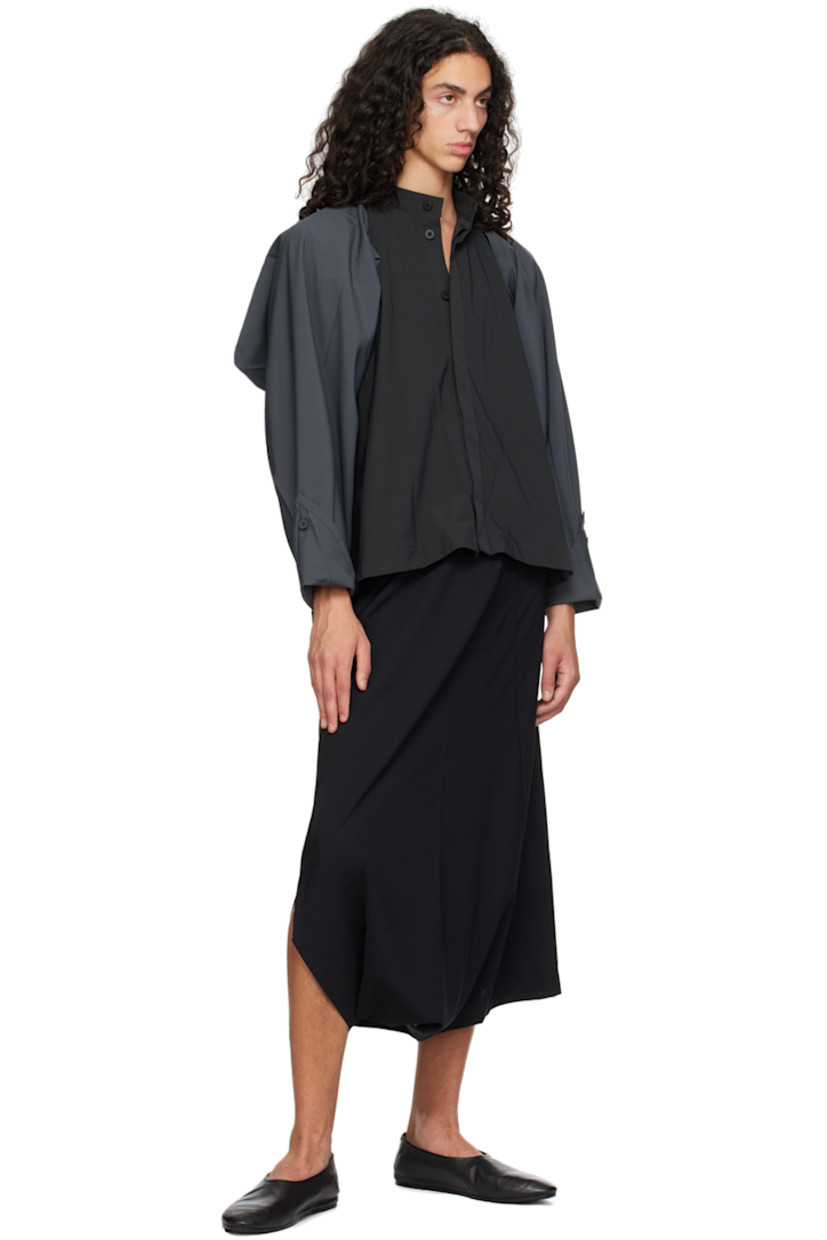 Relaxed-fit and tapered lightweight plain-woven recycled polyester sarouel-style trousers.

· Seamless construction
· Belt loops at partially elasticized waistband
· Three-pocket styling
· Button-fly
· Pleats at front
· Dropped inseam

Supplier color: Black