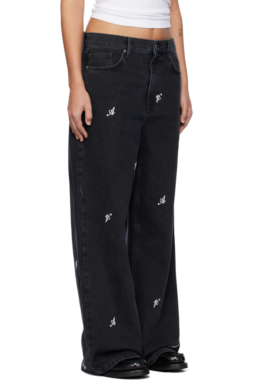 Relaxed-fit and wide-leg non-stretch denim jeans. Fading and embroidered logos throughout. 

· Belt loops
· Five-pocket styling 
· Zip-fly
· Leather logo patch at back waistband
· Logo embroidered at back pocket
· Logo-engraved silver-tone hardware

Supplier color: Black