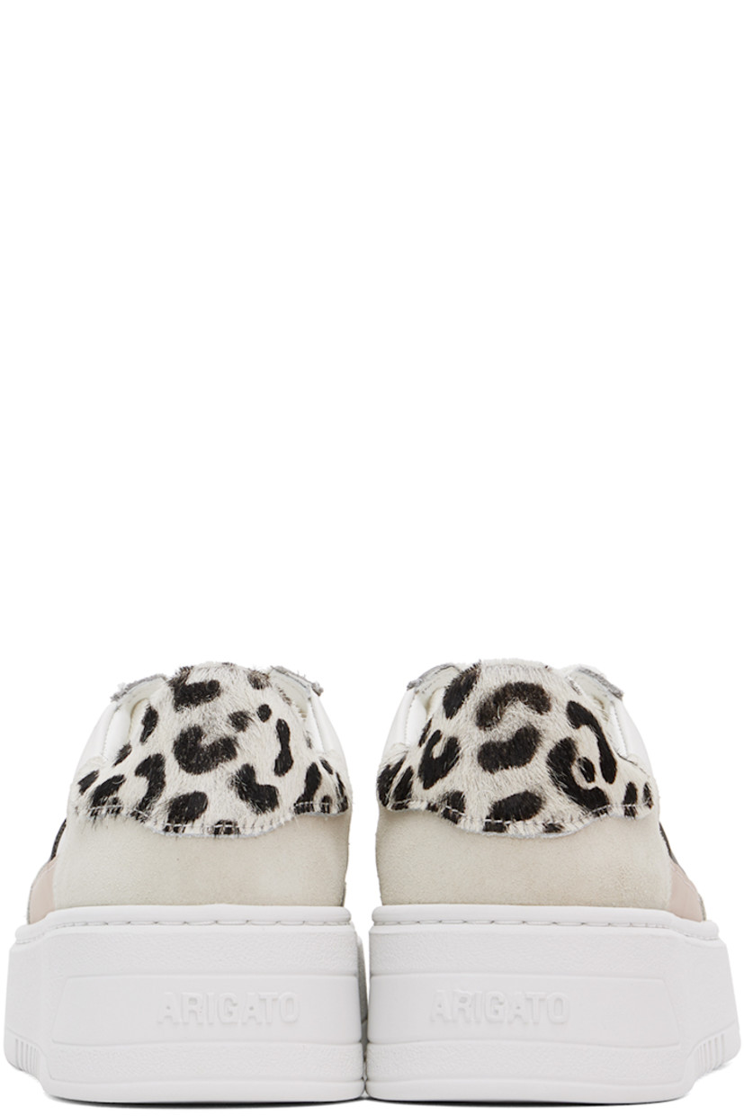 Handcrafted low-top LWG-certified buffed leather and suede sneakers in white and gray. 

· Perforated detailing at toe
· Lace-up closure
· Padded tongue and collar 
· Logo stamp at outer side 
· Leopard pattern printed at hair-on heel tab
· Buffed leather and suede lining
· Logo embossed at rubber platform midsole
· Treaded rubber sole
· Platform: H1.75"

Supplier color: Cremino/Pink