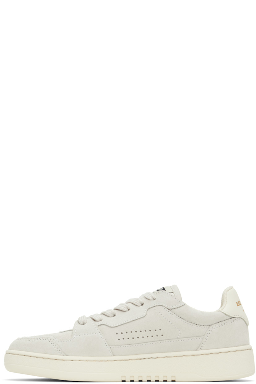 Handcrafted low-top suede sneakers in gray. 

· Perforated detailing throughout
· Lace-up closure
· Logo patch at padded canvas tongue
· Padded collar
· Logo stamp at outer side 
· Logo stamp at buffed leather heel tab 
· Recycled mesh and faux-suede lining
· Logo embossed at textured rubber midsole
· Treaded rubber sole

Supplier color: Off white/Beige