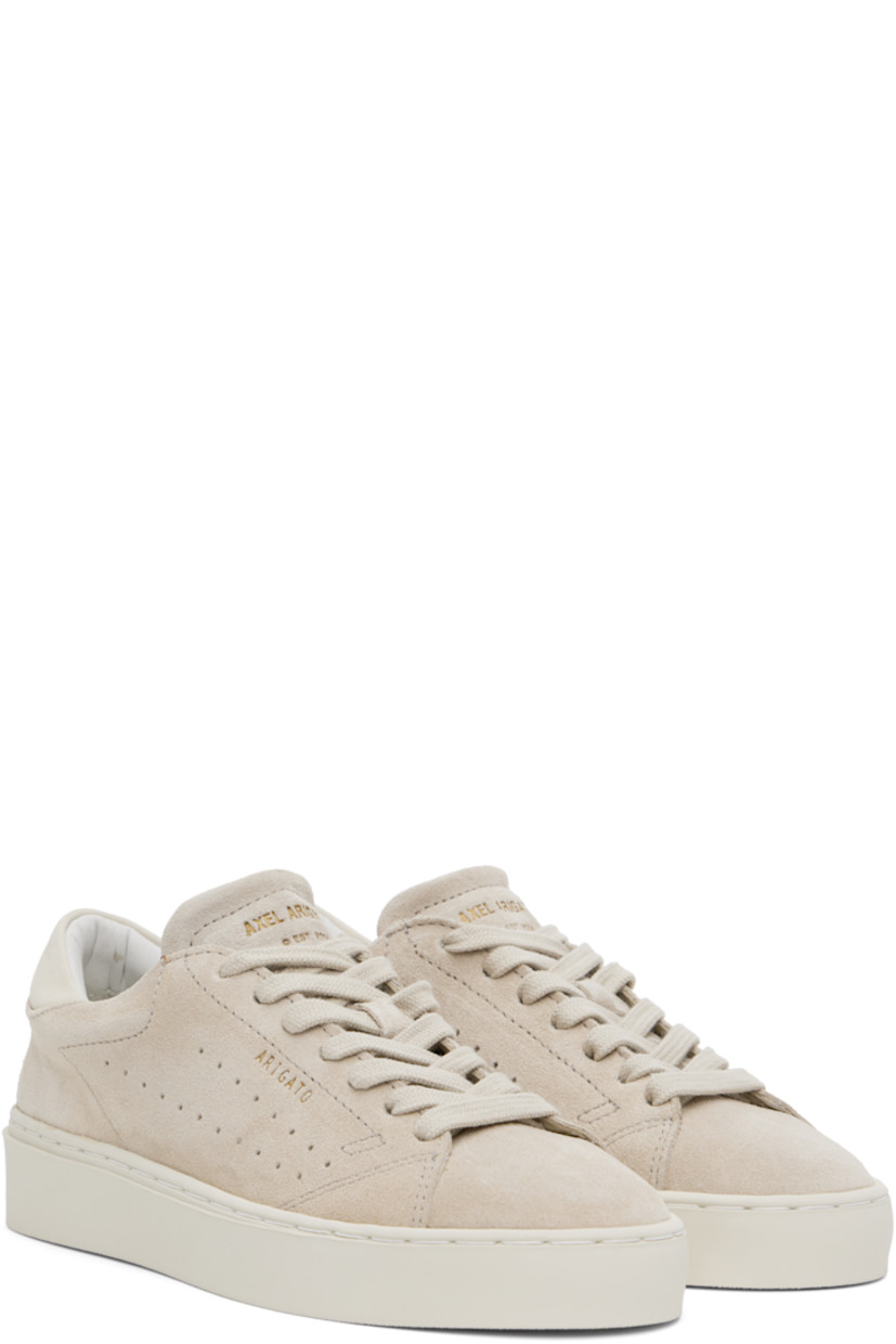Handcrafted low-top buffed suede sneakers in taupe. 

· Lace-up closure
· Logo embossed at padded tongue and outer side
· Padded collar
· Perforated detailing at sides
· Nubuck heel tab
· Logo embossed at heel
· Buffed leather and faux-suede lining
· Treaded rubber sole

Supplier color: Off white/Off white