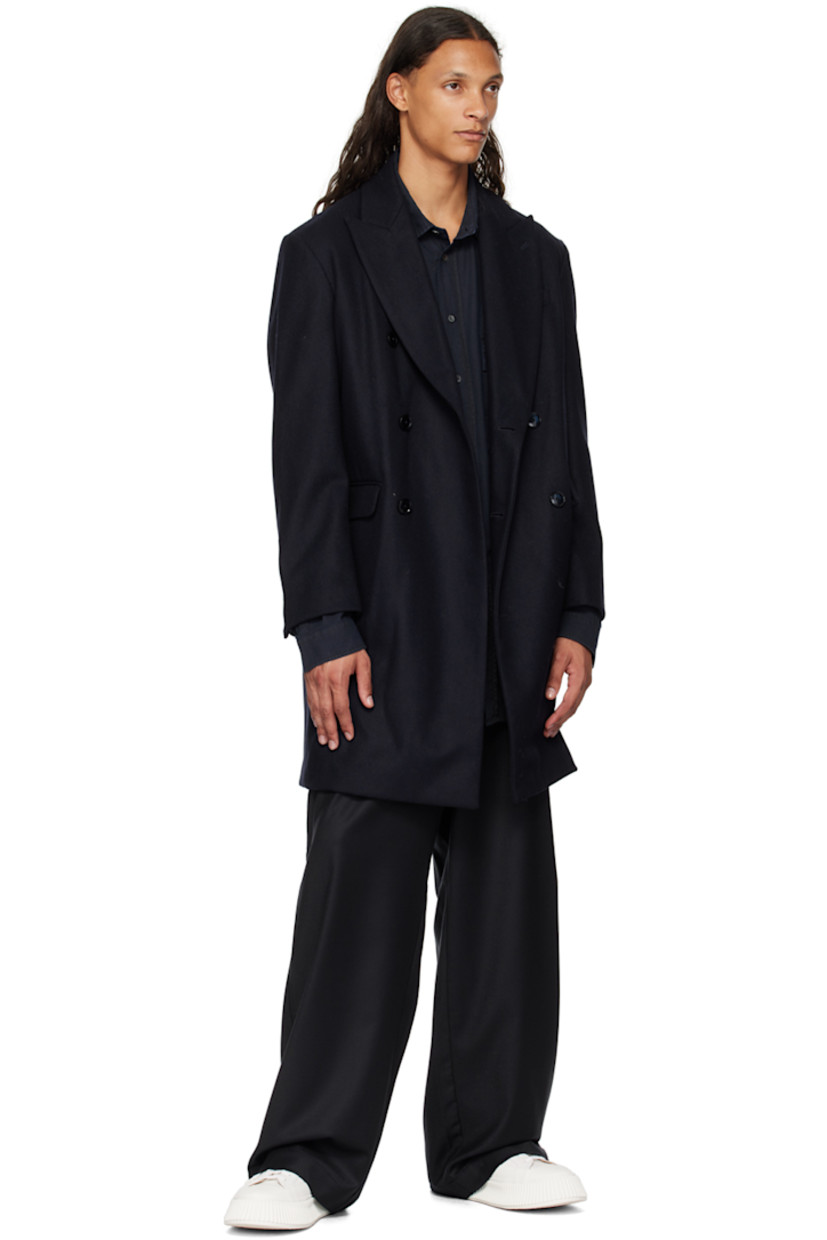 Heavyweight wool-blend barathea coat.

· Peaked lapel
· Double-breasted button closure
· Welt pocket and flap pockets
· Two-button surgeon's cuffs
· Central vent at back hem
· Patch pocket at interior
· Partially lined

Supplier color: Navy
