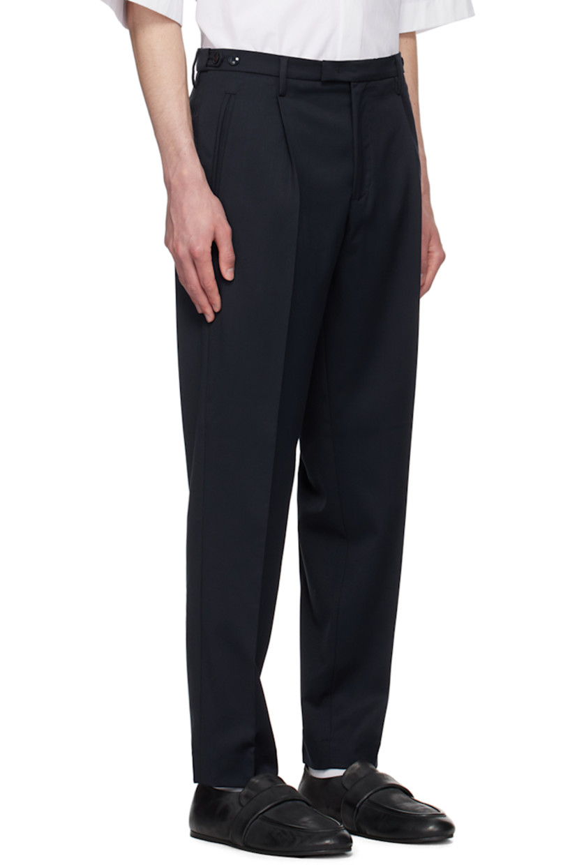 Slim-fit stretch plain-woven virgin wool trousers. 

· Mid-rise
· Belt loops
· Four-pocket styling
· Zip-fly
· Pleats at front
· Creased legs 
· Button tabs at back waistband

Supplier color: Navy