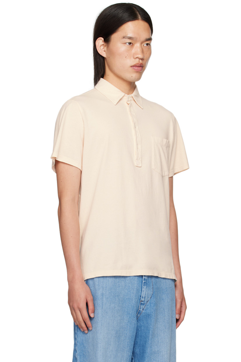 Garment-dyed cotton jersey polo. 

· Spread collar
· Three-button placket 
· Patch pocket 
· Tennis-tail hem 
· Logo flag at side seam

Supplier color: Cristal