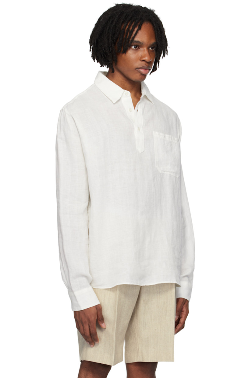Plain-woven linen shirt. Jacquard stripes throughout.

· Spread collar
· Three-button placket
· Patch pocket
· Embroidered detailing at side seam
· Pleat at single-button barrel cuffs
· Locker loop at back yoke

Supplier color: Thasos beach
