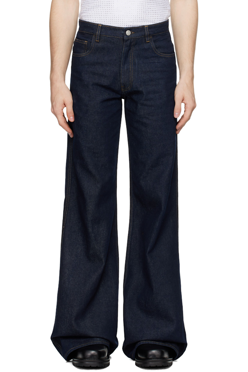 Slim-fit, wide-leg, and flared non-stretch denim jeans. Fading throughout.

· High-rise
· Belt loops
· Five-pocket styling
· Leather logo patch at back waist
· Contrast stitching in tan

Supplier color: Blue Raw