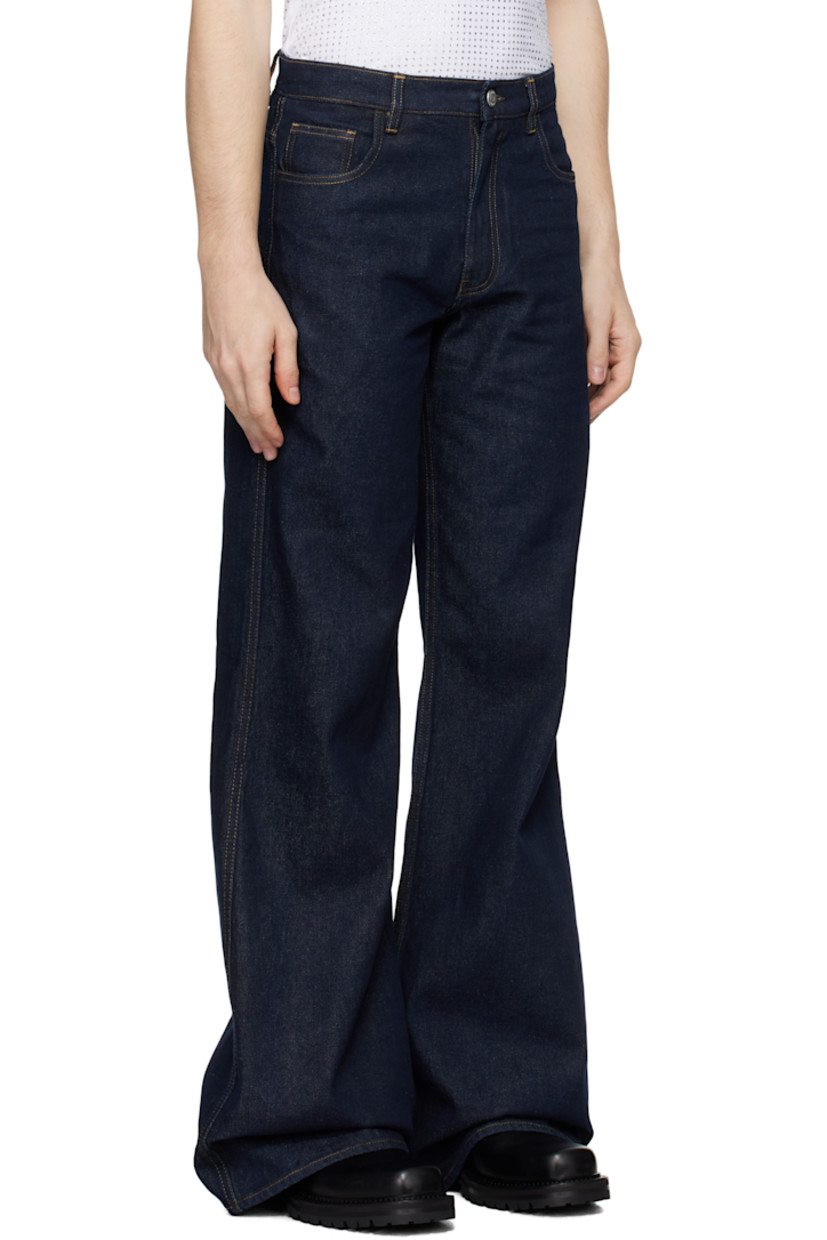 Slim-fit, wide-leg, and flared non-stretch denim jeans. Fading throughout.

· High-rise
· Belt loops
· Five-pocket styling
· Leather logo patch at back waist
· Contrast stitching in tan

Supplier color: Blue Raw
