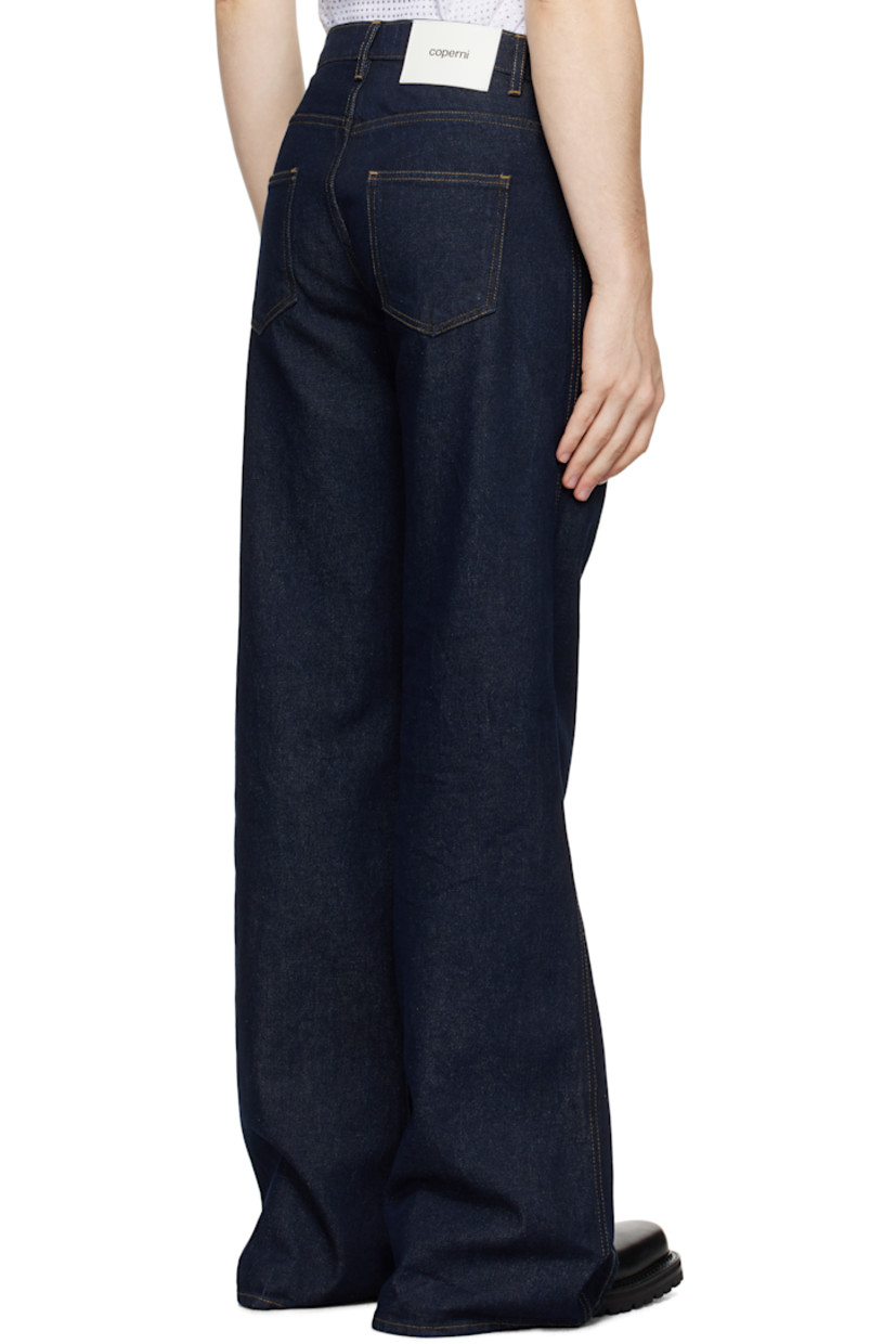 Slim-fit, wide-leg, and flared non-stretch denim jeans. Fading throughout.

· High-rise
· Belt loops
· Five-pocket styling
· Leather logo patch at back waist
· Contrast stitching in tan

Supplier color: Blue Raw