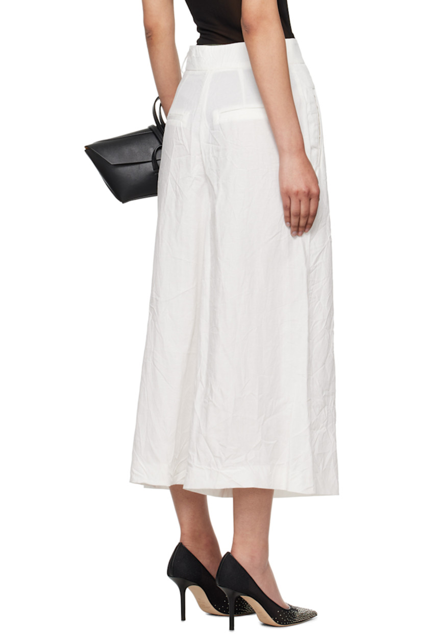 Crinkled TENCEL™ lyocell- and linen-blend canvas trousers.

· Belt loops
· Four-pocket styling
· Zip-fly

Supplier color: White