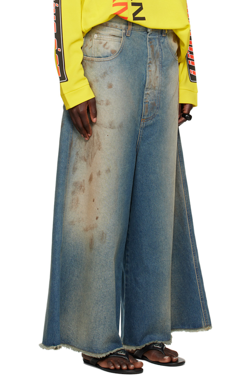 Wide-leg non-stretch denim jeans. Fading and smudging throughout.

· Belt loops
· Five-pocket styling
· Zip-fly
· Frayed edge at cropped legs
· Logo patch at back waistband
· Logo-engraved silver-tone hardware
 
Supplier color: Stained blue