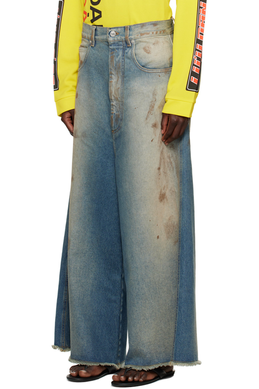 Wide-leg non-stretch denim jeans. Fading and smudging throughout.

· Belt loops
· Five-pocket styling
· Zip-fly
· Frayed edge at cropped legs
· Logo patch at back waistband
· Logo-engraved silver-tone hardware
 
Supplier color: Stained blue