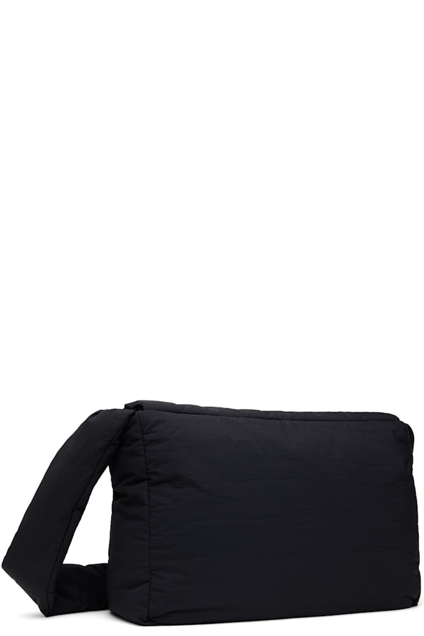 Padded nylon taffeta shoulder bag in black.

· Adjustable shoulder strap
· Logo hardware at magnetic flap
· Zip pocket at interior
· Twill lining
· H11" x W15" x D6"

Supplier color: Black