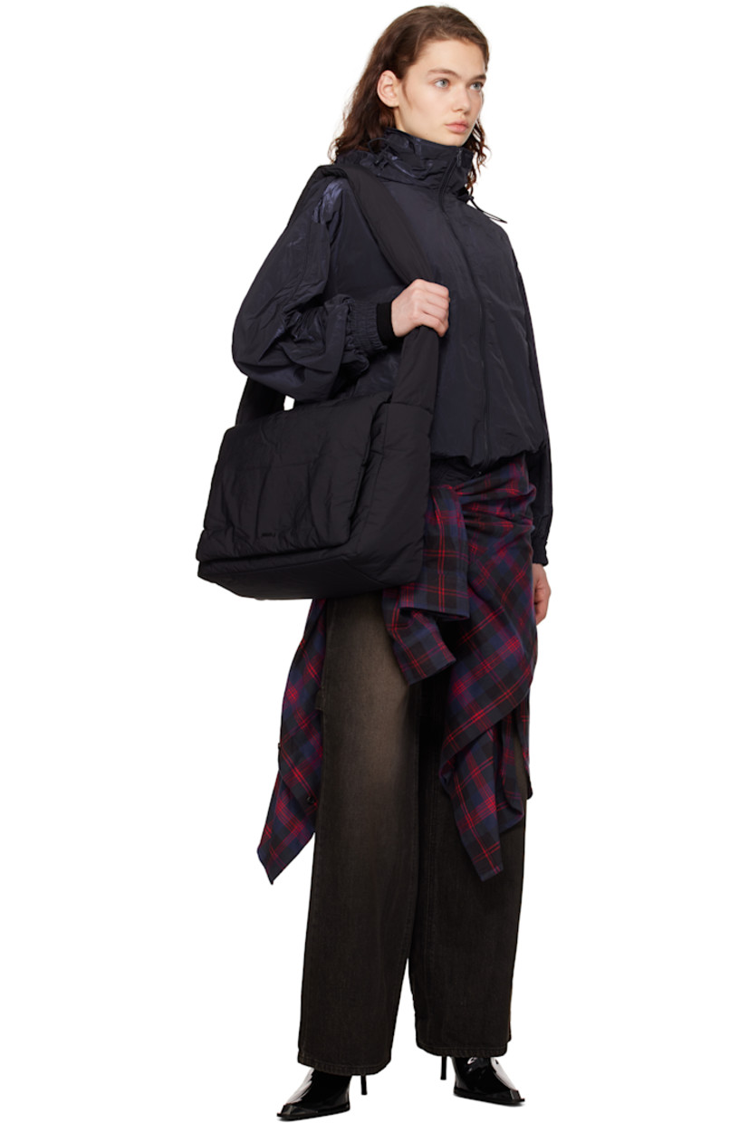 Padded nylon taffeta shoulder bag in black.

· Adjustable shoulder strap
· Logo hardware at magnetic flap
· Zip pocket at interior
· Twill lining
· H11" x W15" x D6"

Supplier color: Black