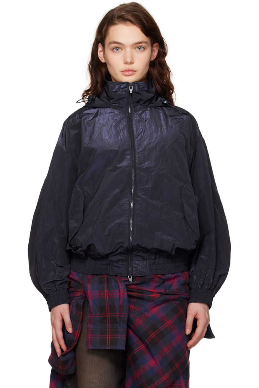 Crinkled polyester taffeta jacket. Piping throughout.

· Bungee-style drawstring at stowaway hood
· Funnel neck 
· Two-way zip closure
· Flap pockets
· Elasticized hem and cuffs
· Dropped shoulders
· Logo embroidered at back collar
· Full mesh lining

Supplier color: Navy