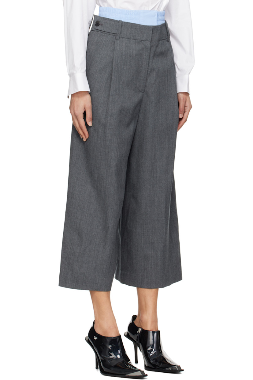 Wool twill trousers.

· Layered construction
· Detachable boxers-style panel at waistband
· Belt loops and button tabs
· Four-pocket styling
· Zip fly
· Pleats at front

Supplier color: Grey
