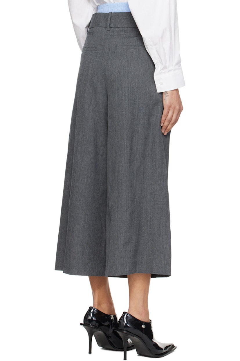 Wool twill trousers.

· Layered construction
· Detachable boxers-style panel at waistband
· Belt loops and button tabs
· Four-pocket styling
· Zip fly
· Pleats at front

Supplier color: Grey