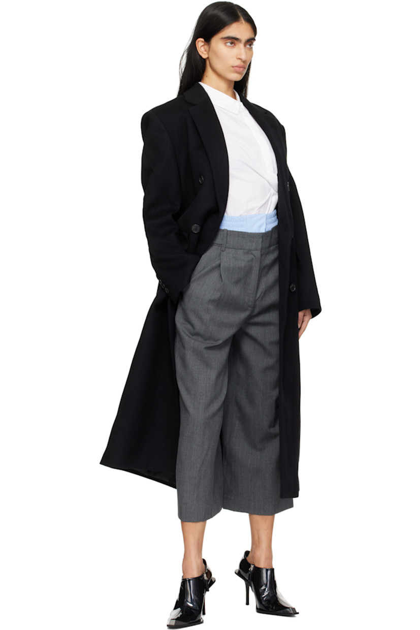 Wool twill trousers.

· Layered construction
· Detachable boxers-style panel at waistband
· Belt loops and button tabs
· Four-pocket styling
· Zip fly
· Pleats at front

Supplier color: Grey