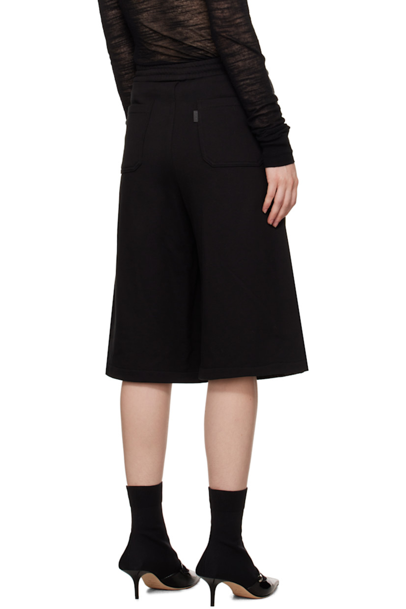 French terry and non-stretch denim shorts. Fading and whiskering throughout. 

· Paneled construction 
· Concealed drawstring at elasticized waistband
· Belt loops
· Five-pocket styling 
· Zip fly 
· Logo flag at back pocket

Supplier color: Black