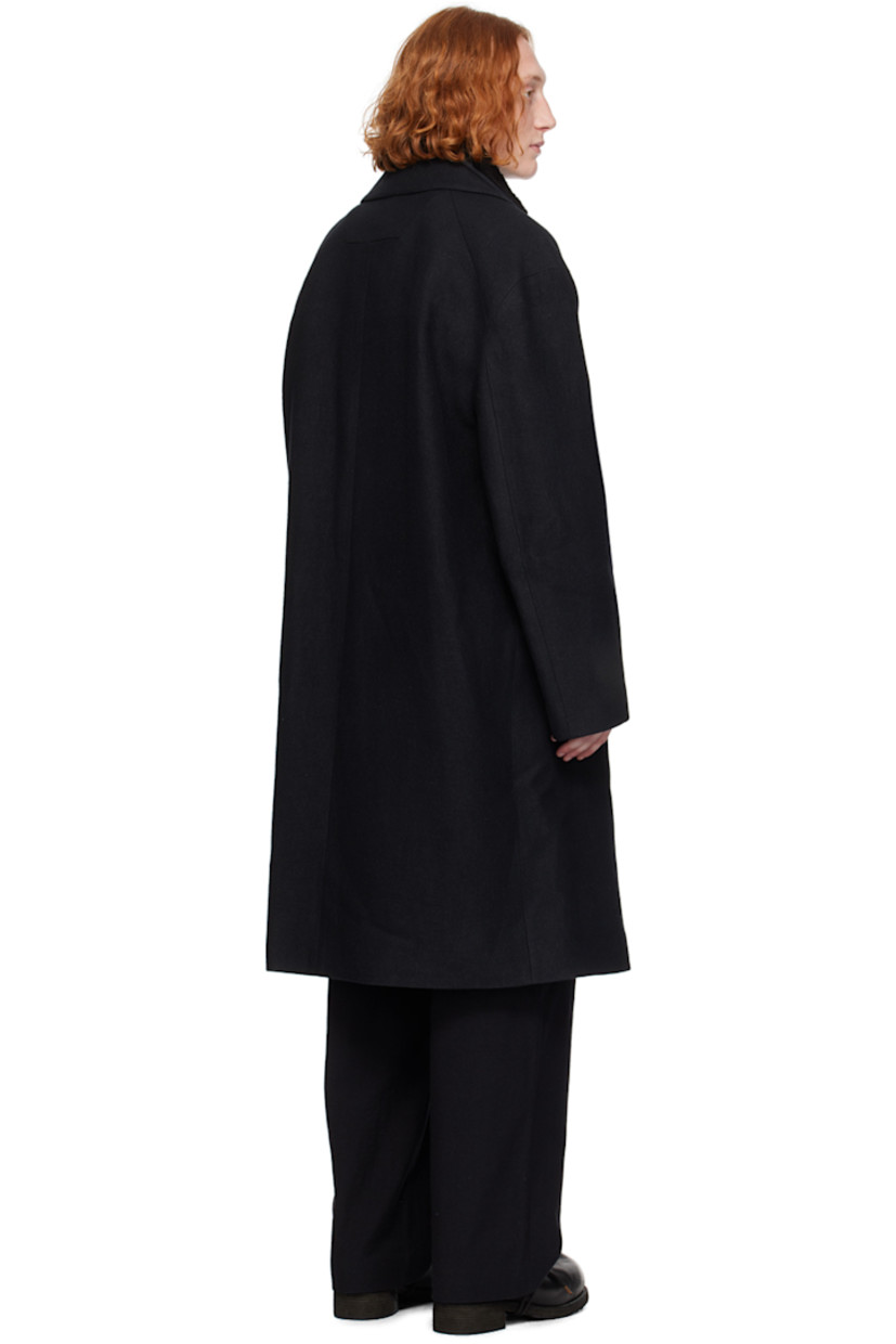 Wool twill coat. Detachable vest-style faux-shearling and padded canvas underlay.

· Layered construction
· Notched lapel
· Button closure 
· Welt pockets
· Raglan sleeves
· Full satin lining

Supplier color: Black