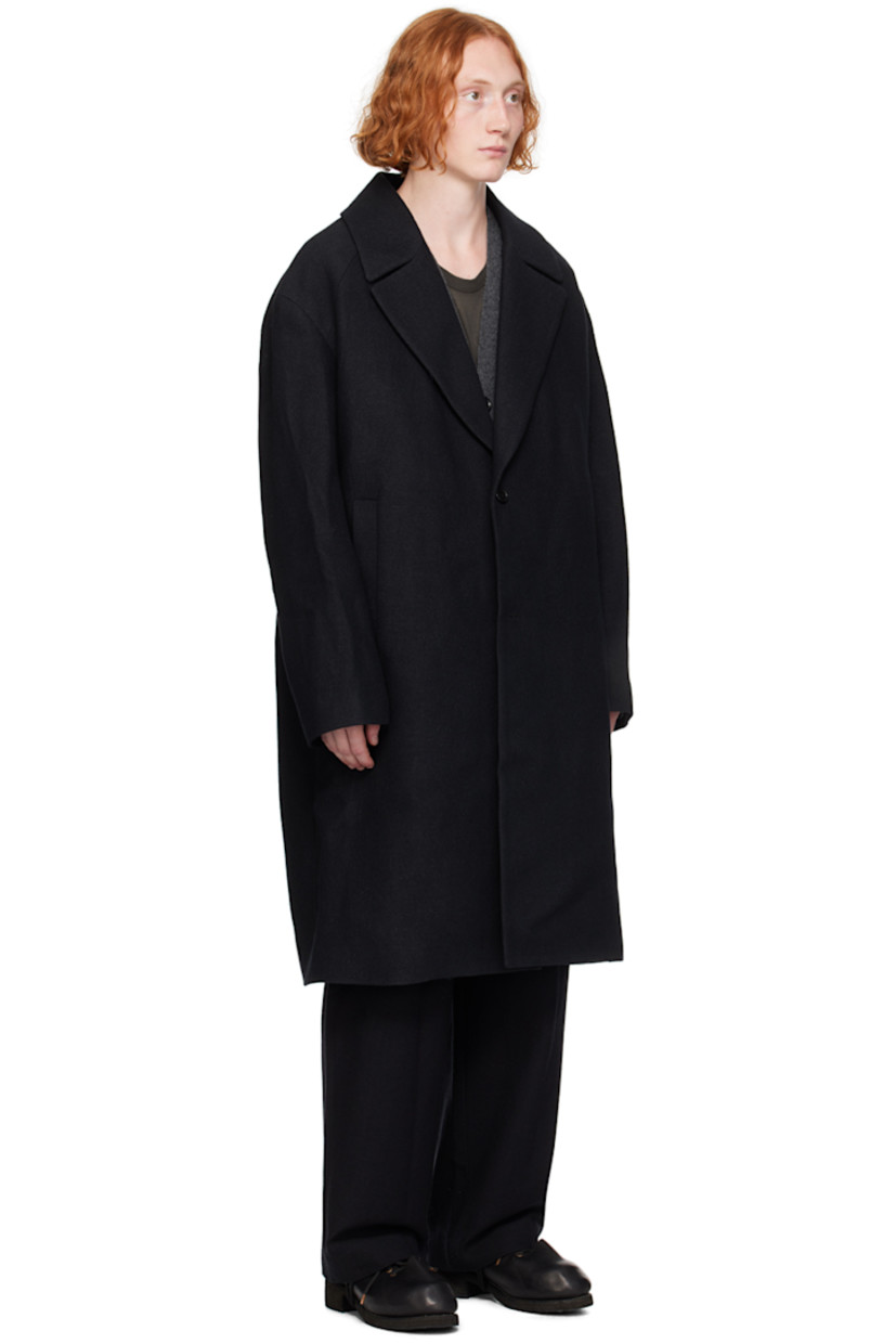 Wool twill coat. Detachable vest-style faux-shearling and padded canvas underlay.

· Layered construction
· Notched lapel
· Button closure 
· Welt pockets
· Raglan sleeves
· Full satin lining

Supplier color: Black