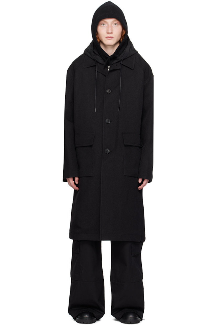 Wool-blend twill coat. Detachable hood-style cotton jersey and nylon taffeta overlay.

· Open spread collar
· Button closure
· Flap pockets 
· Raglan sleeves
· Welt pocket at interior
· Full satin lining

Supplier color: Black