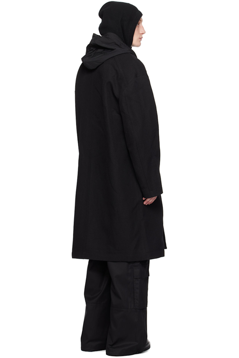 Wool-blend twill coat. Detachable hood-style cotton jersey and nylon taffeta overlay.

· Open spread collar
· Button closure
· Flap pockets 
· Raglan sleeves
· Welt pocket at interior
· Full satin lining

Supplier color: Black
