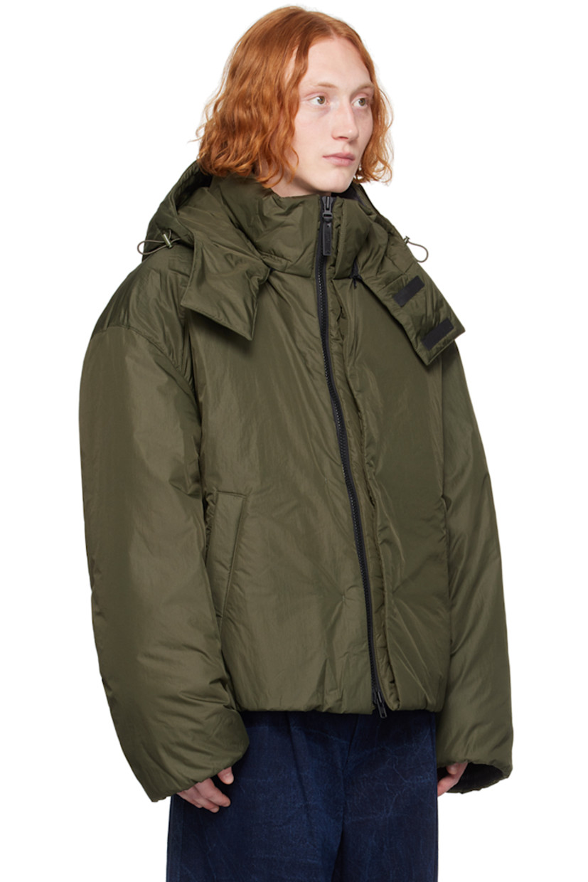 Insulated nylon ripstop jacket. 

· Bungee-style drawstring at detachable hood
· Funnel neck
· Two-way zip closure
· Welt pockets
· Concealed bungee-style drawstring at hem and cuffs
· Zip vent at side seams
· Welt pocket at interior
· Full polyester satin lining 

Supplier color: Khaki