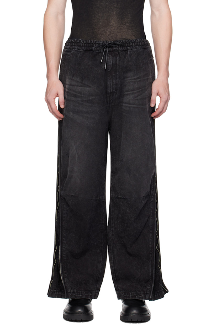 Non-stretch denim jeans. Whiskering, fading, and distressing throughout. 

· Drawstring at elasticized waistband
· Four-pocket styling
· Zip-fly
· Zip expansion panel at outseams 

Supplier color: Black