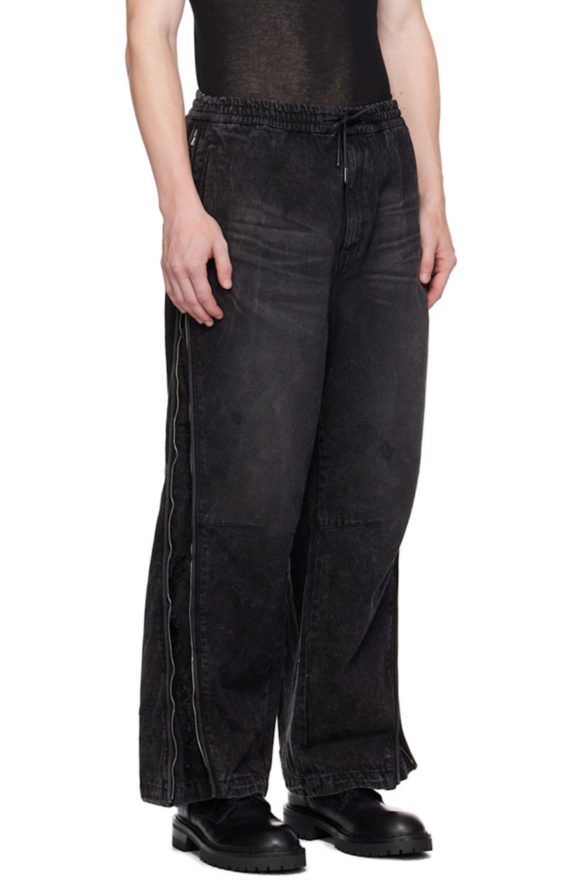 Non-stretch denim jeans. Whiskering, fading, and distressing throughout. 

· Drawstring at elasticized waistband
· Four-pocket styling
· Zip-fly
· Zip expansion panel at outseams 

Supplier color: Black