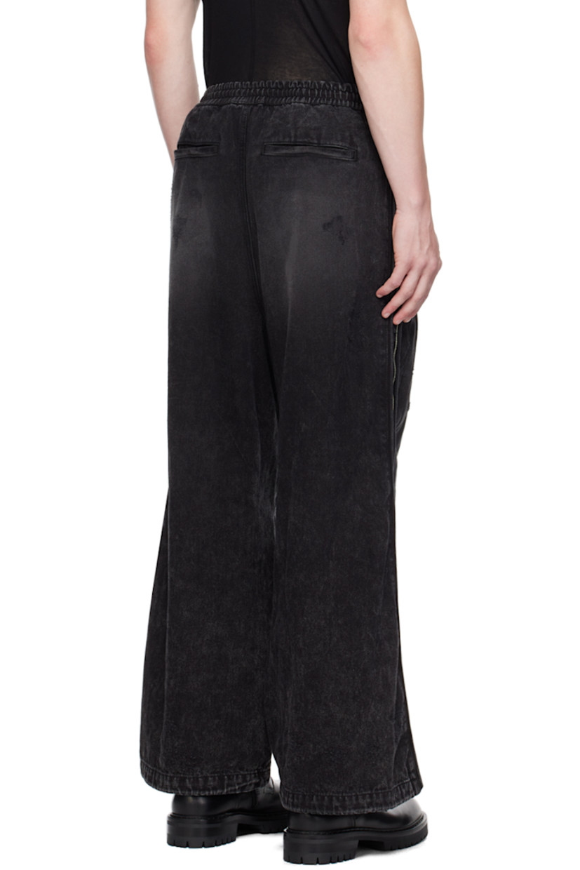 Non-stretch denim jeans. Whiskering, fading, and distressing throughout. 

· Drawstring at elasticized waistband
· Four-pocket styling
· Zip-fly
· Zip expansion panel at outseams 

Supplier color: Black