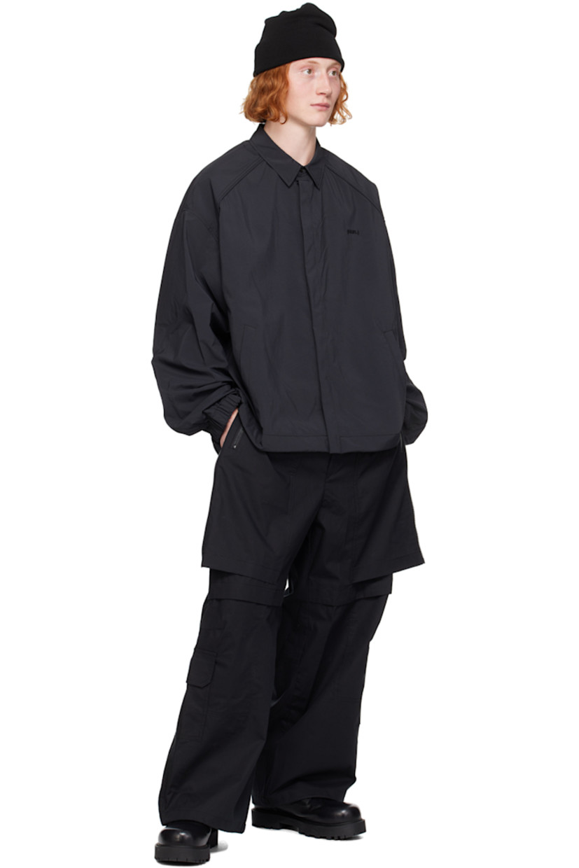 Loose-fit polyester poplin shirt.

· Spread collar
· Concealed button closure
· Logo embroidered at chest
· Welt pockets
· Bungee-style drawstring at hem 
· Piping at raglan sleeves
· Elasticized cuffs
· Central seam at back

Supplier color: Black