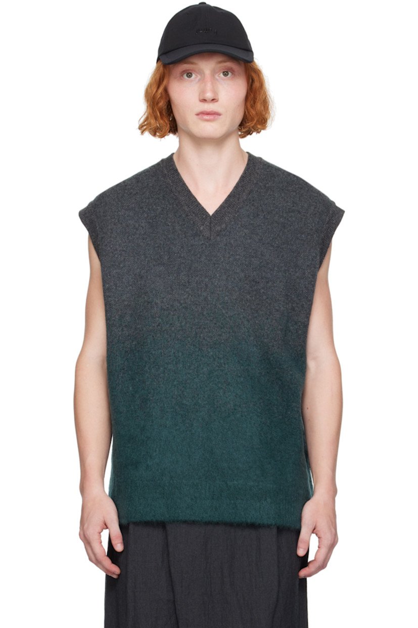 Knit wool- and mohair-blend vest. Jacquard gradient throughout.

· Rib knit V-neck, hem, and armscyes
· Button vent at side seams

Supplier color: Green