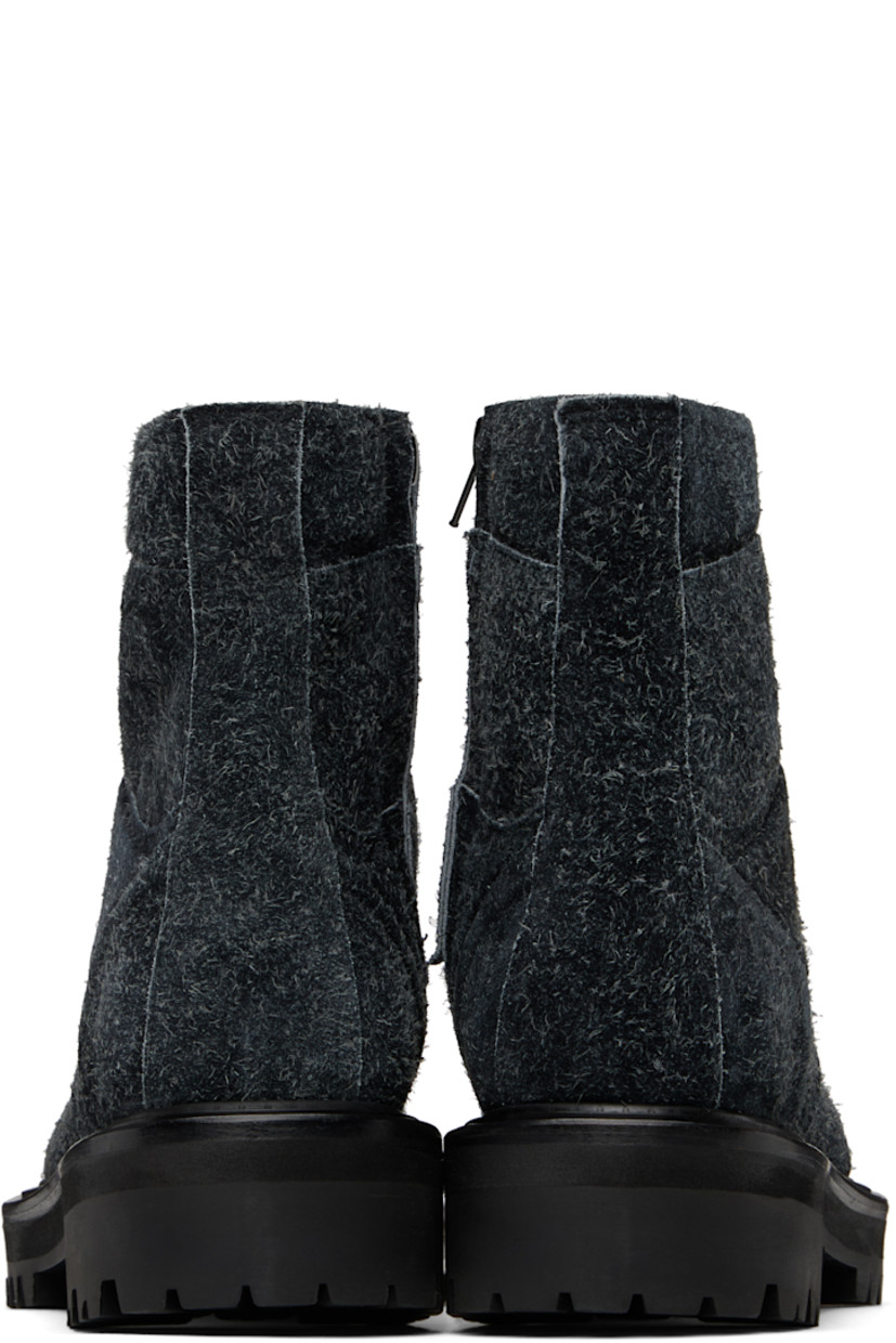 Ankle-high paneled nubuck boots in black.

· Lace-up closure
· Padded collar
· Pull-loop at heel collar
· Zip closure at inner side
· Treaded Vibram® rubber sole 

Supplier color: Ash