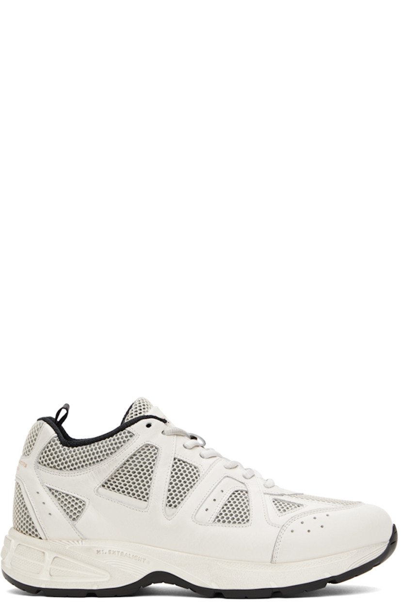 Handcrafted low-top buffed leather and mesh sneakers in off-white.

· Smudging and perforated detailing throughout
· Lace-up closure
· Logo stamp at padded tongue and heel counter
· Padded collar
· Pull-loop at heel
· Mesh lining 
· EVA foam rubber midsole
· Treaded rubber sole

Supplier color: Dirty burro/Off-White