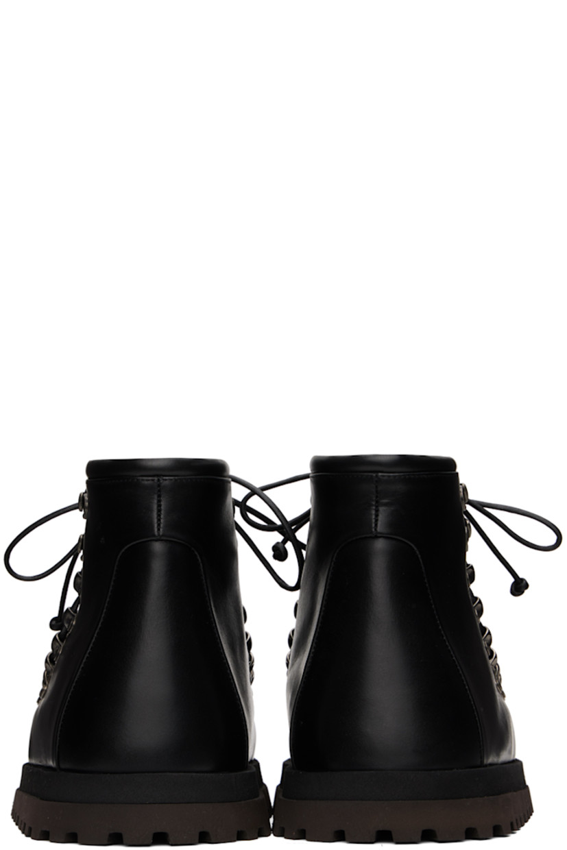 Ankle-high buffed leather boots in black. 

· Moc toe
· Lace-up closure
· Padded tongue and collar
· Grained leather lining
· Logo-printed padded hand-wrapped leather insole
· Stacked foam rubber midsole
· Treaded rubber sole

Supplier color: Black/Dark brown
