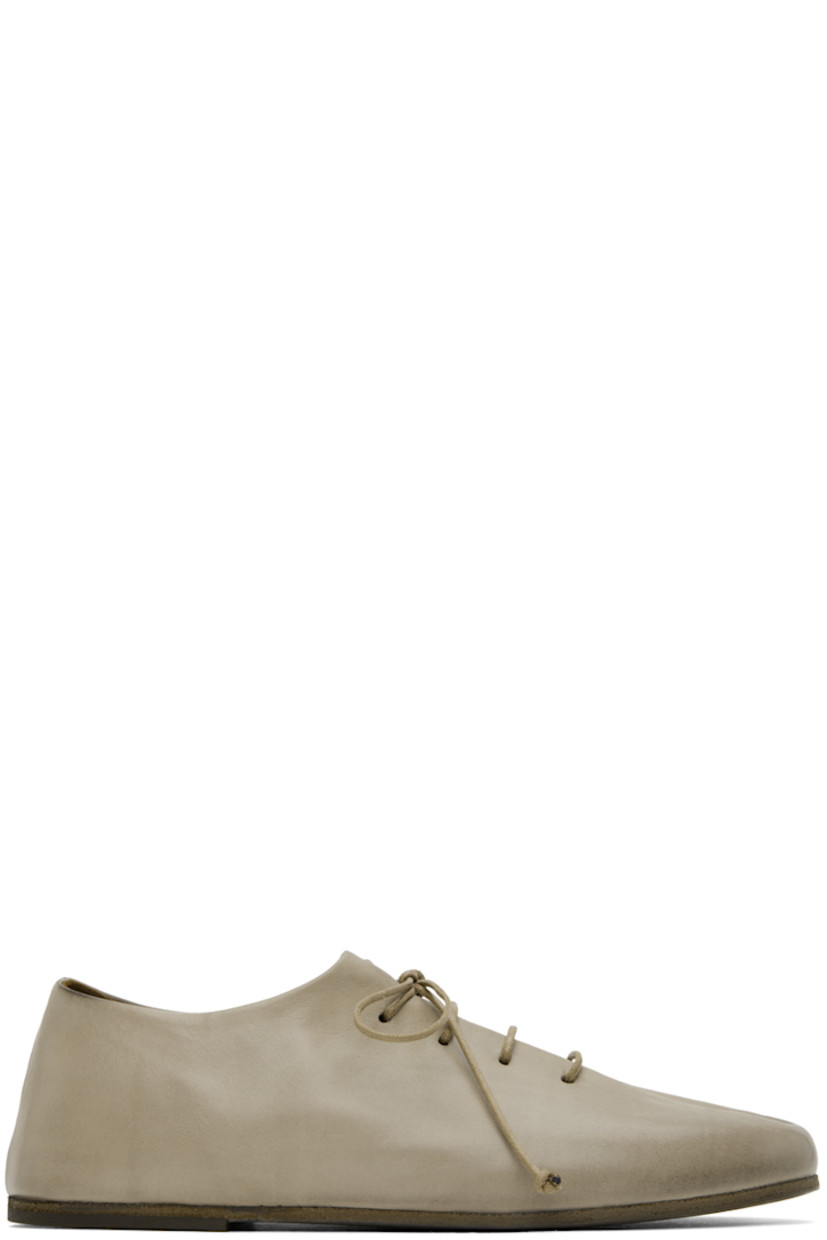 Buffed calfskin derbys in gray.

· Lace-up closure
· Pleats at vamp
· Buffed leather and nubuck lining
· Hand-colored leather sole with rubber injection

Supplier color: Clay