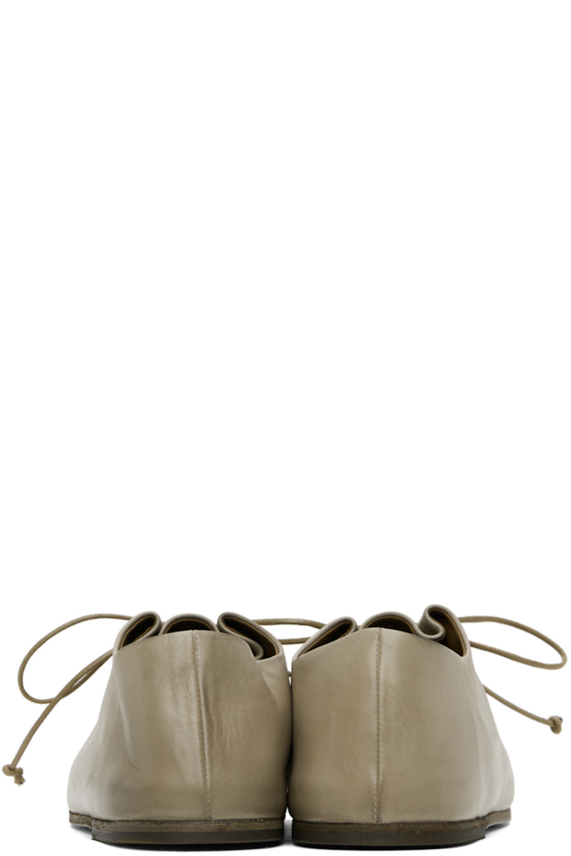 Buffed calfskin derbys in gray.

· Lace-up closure
· Pleats at vamp
· Buffed leather and nubuck lining
· Hand-colored leather sole with rubber injection

Supplier color: Clay