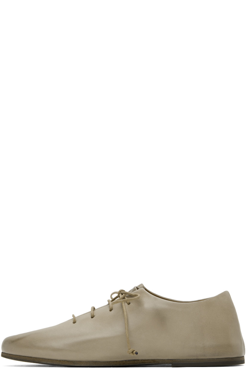 Buffed calfskin derbys in gray.

· Lace-up closure
· Pleats at vamp
· Buffed leather and nubuck lining
· Hand-colored leather sole with rubber injection

Supplier color: Clay