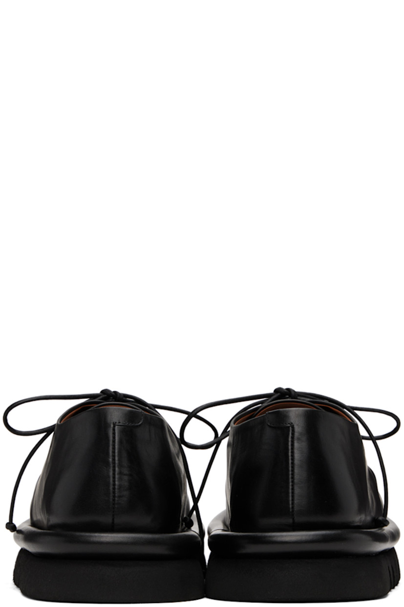 Buffed leather derbys in black.

· Lace-up closure
· Logo embossed at leather footbed
· Grained leather and suede lining
· Hand-milled lugged microfibre sole

Supplier color: Black