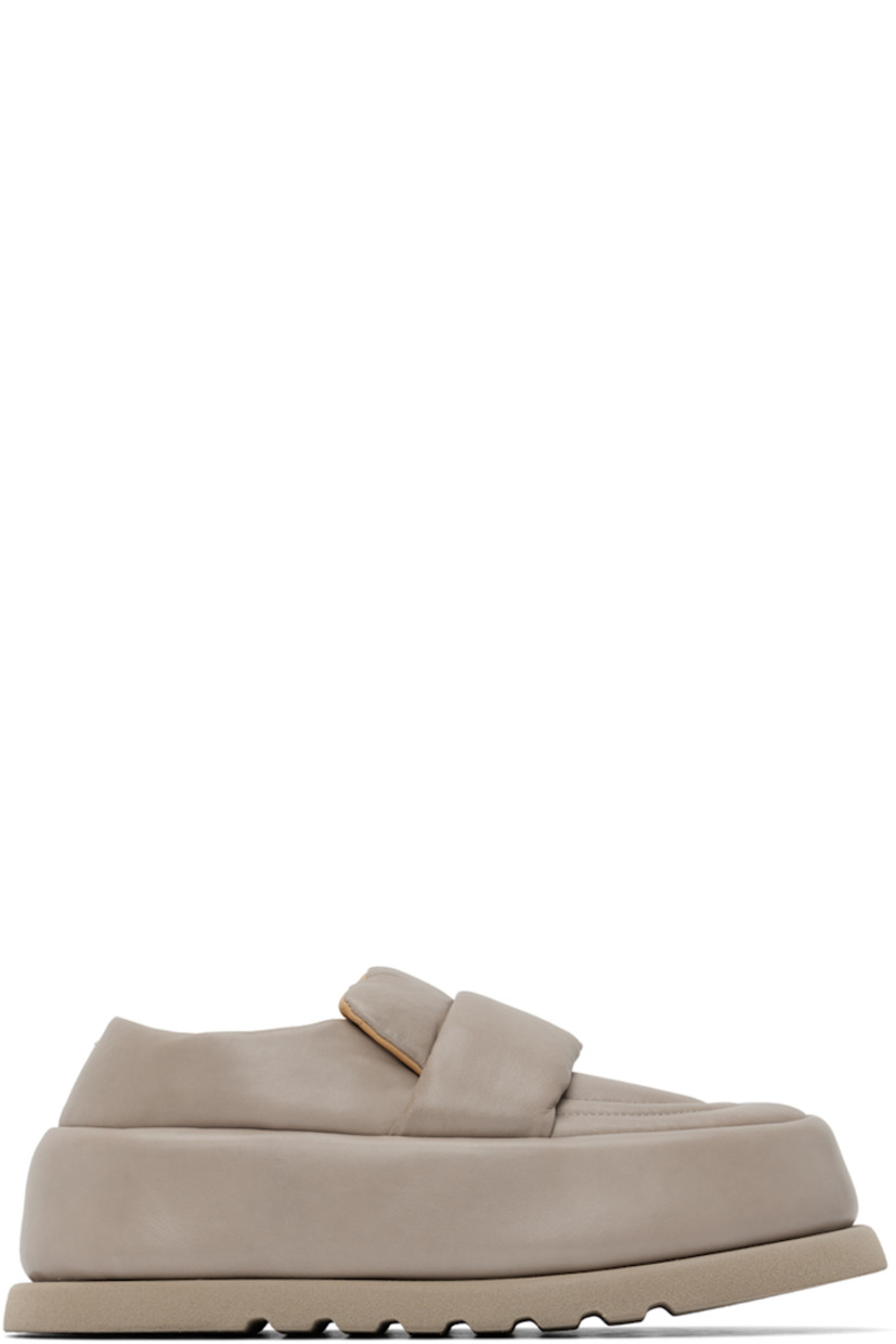 Handcrafted padded buffed calfskin loafers in taupe.

· Moc toe
· Strap at vamp
· Logo embossed at leather footbed
· Buffed leather and suede lining 
· Covered platform midsole
· Treaded foam rubber sole 
· Platform: H2.5"

Supplier color: Clay