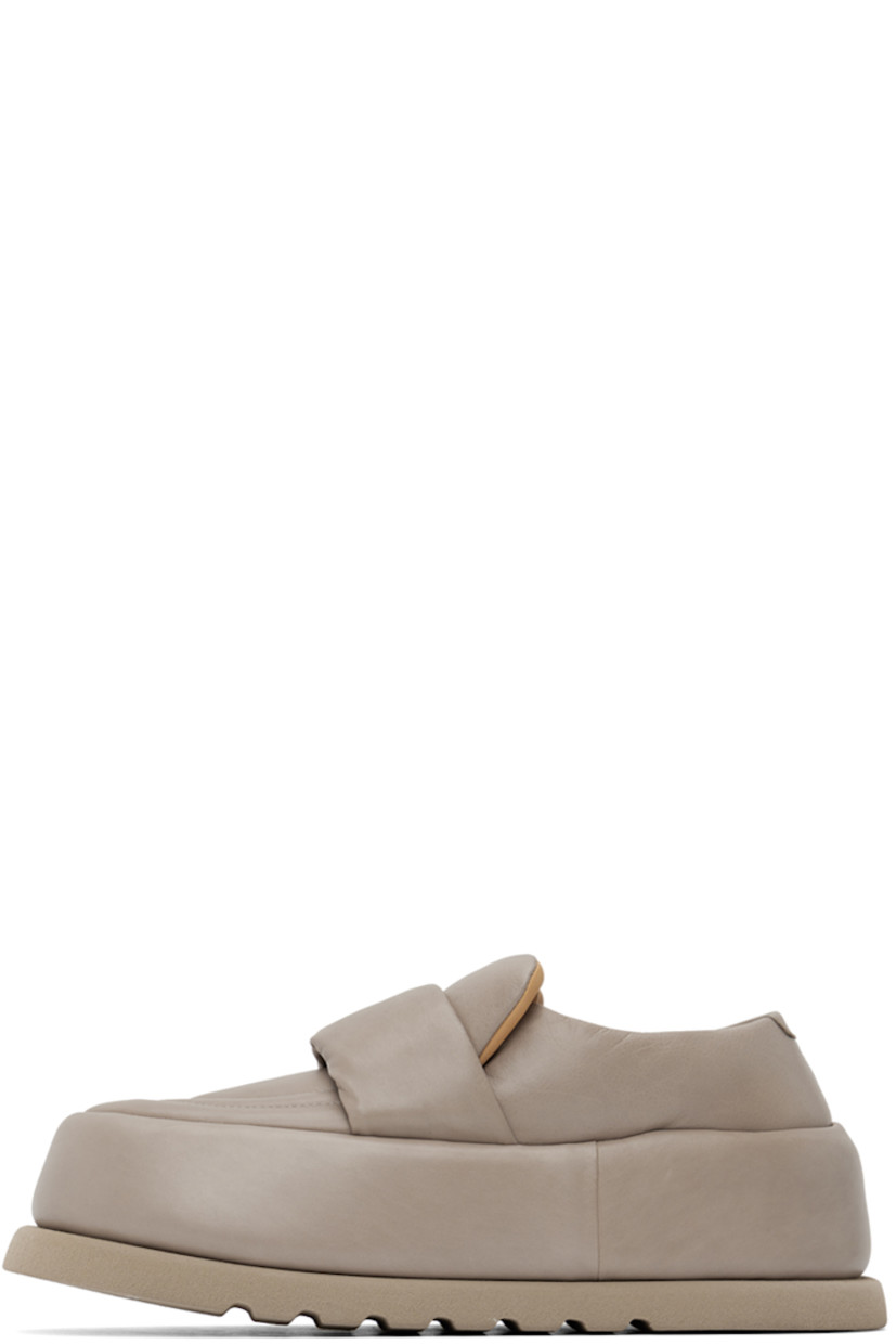 Handcrafted padded buffed calfskin loafers in taupe.

· Moc toe
· Strap at vamp
· Logo embossed at leather footbed
· Buffed leather and suede lining 
· Covered platform midsole
· Treaded foam rubber sole 
· Platform: H2.5"

Supplier color: Clay