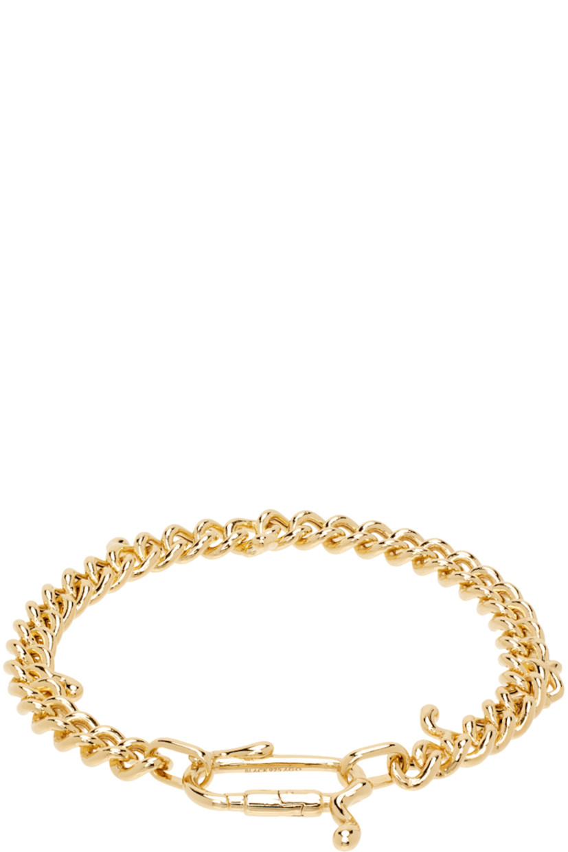 Curb chain bracelet in 18k gold-plated recycled sterling silver. 

· Graphic charms at length
· Lanyard-clasp fastening

Supplier color: Gold