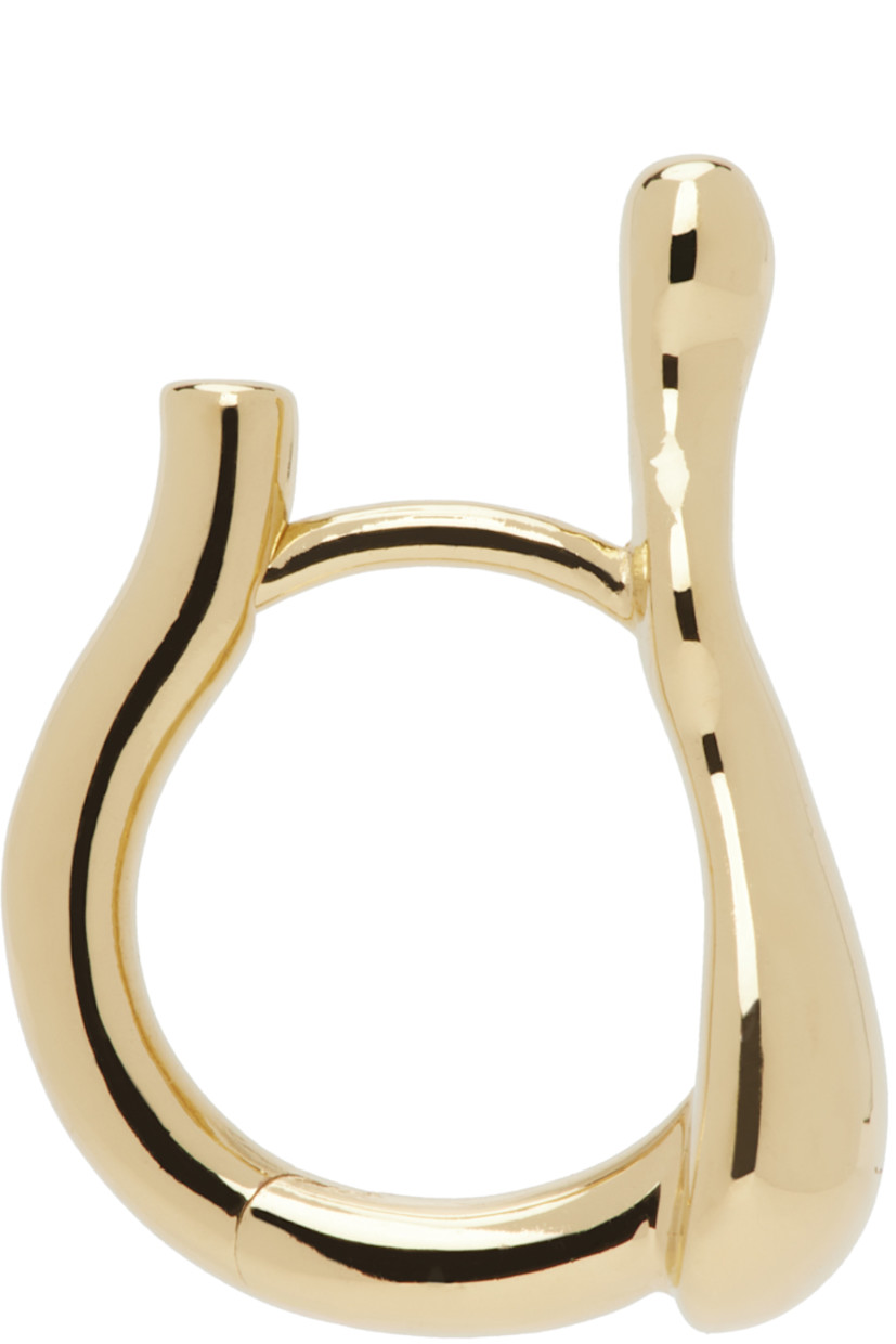 Single hoop earring in 18k gold-plated recycled sterling silver. 

· Graphic hardware at face
· Hinged-post fastening 
· H0.75" x W0.5"

Supplier color: Gold