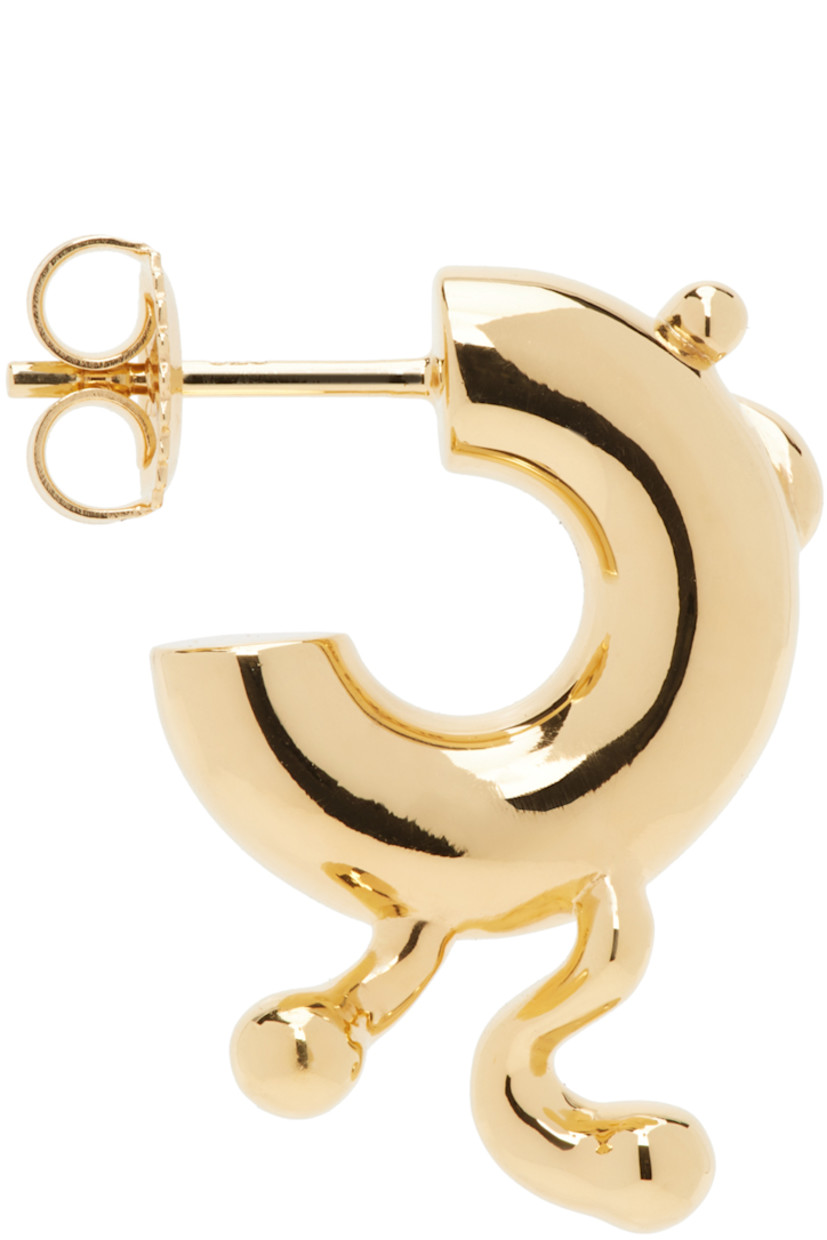 Single open hoop earring in 18k gold-plated recycled sterling silver. 

· Graphic detailing at face
· Post-stud fastening
· D0.5"

Supplier color: Gold