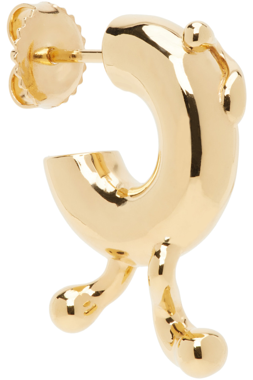 Single open hoop earring in 18k gold-plated recycled sterling silver. 

· Graphic detailing at face
· Post-stud fastening
· D0.5"

Supplier color: Gold