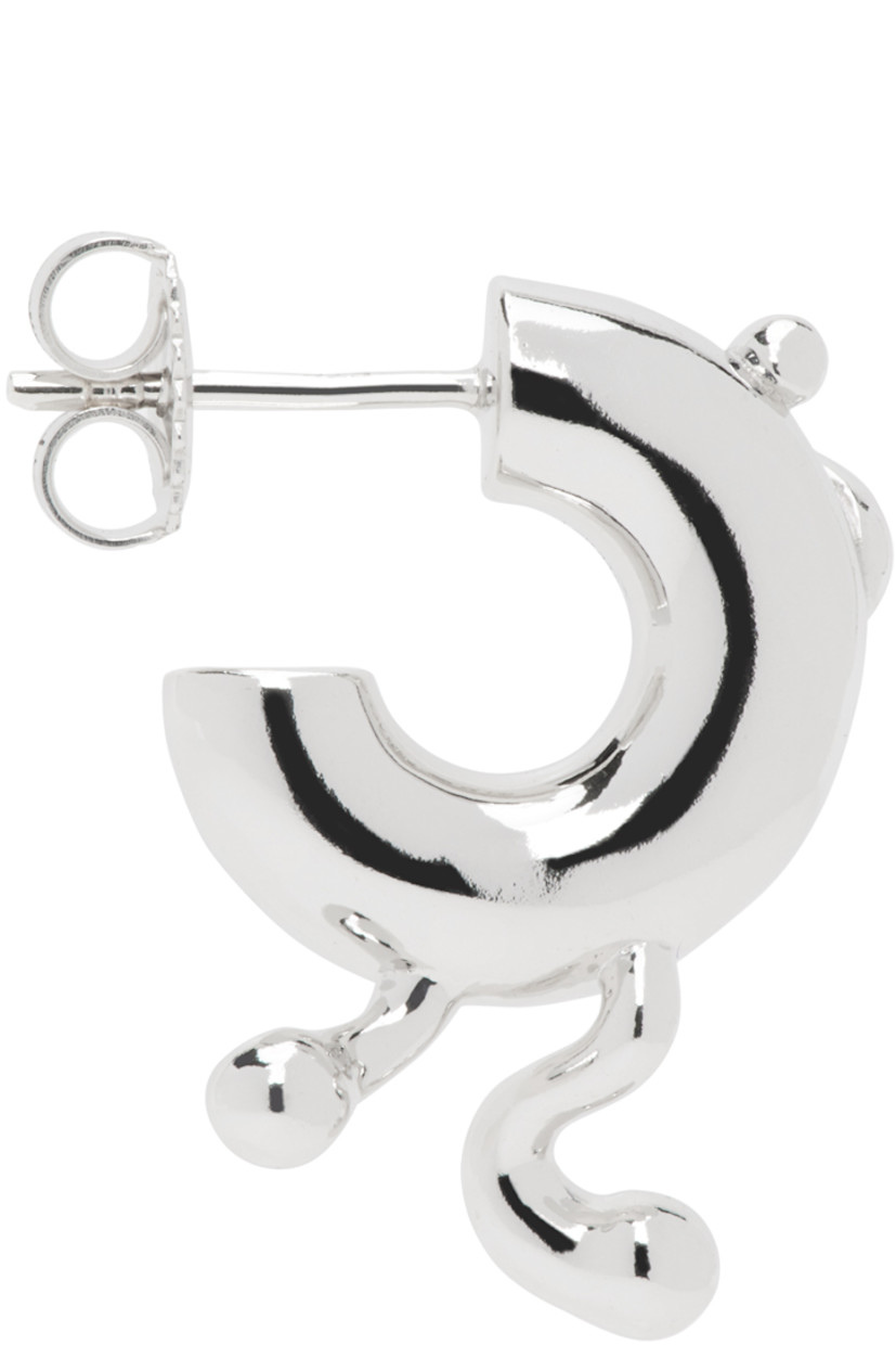 Single open hoop earring in rhodium-plated recycled sterling silver. 

· Graphic detailing at face
· Post-stud fastening
· D0.5"

Supplier color: Silver
