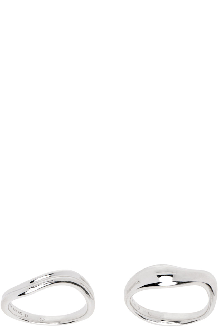 Set of two band rings in rhodium-plated recycled sterling silver. Logo engraved at inner band.

Supplier color: Silver