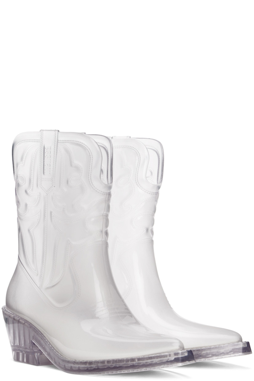 Ankle-high transparent and lightweight PVC boots.

· Quilted detailing throughout
· Pointed toe
· Logo embossed at sides
· Grenflex insole
· Rubber block heel
· Treaded rubber sole
· Heel: H2.25"

Supplier color: Silver